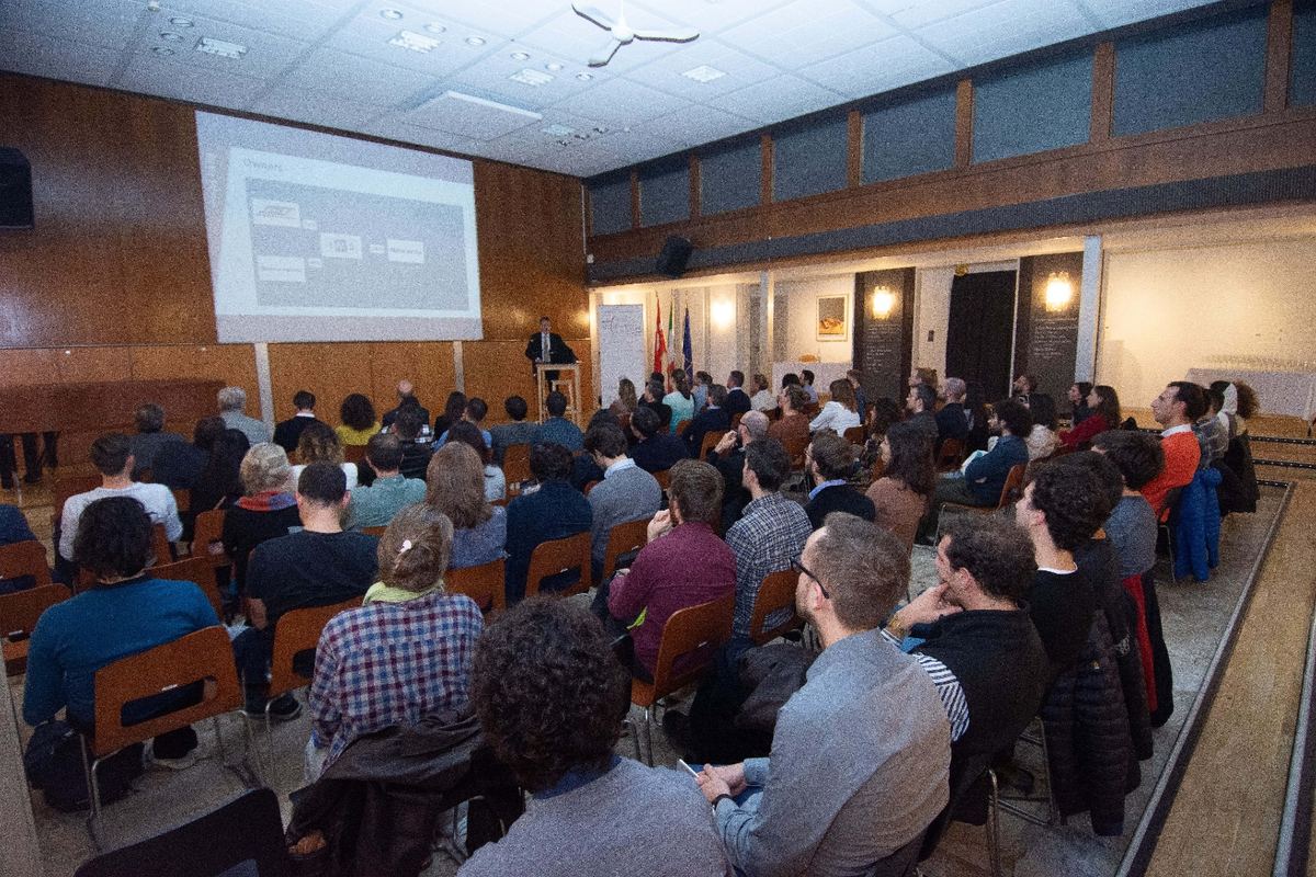 Audience listening to a company presentation in the hall of the Italian Institute of Culture